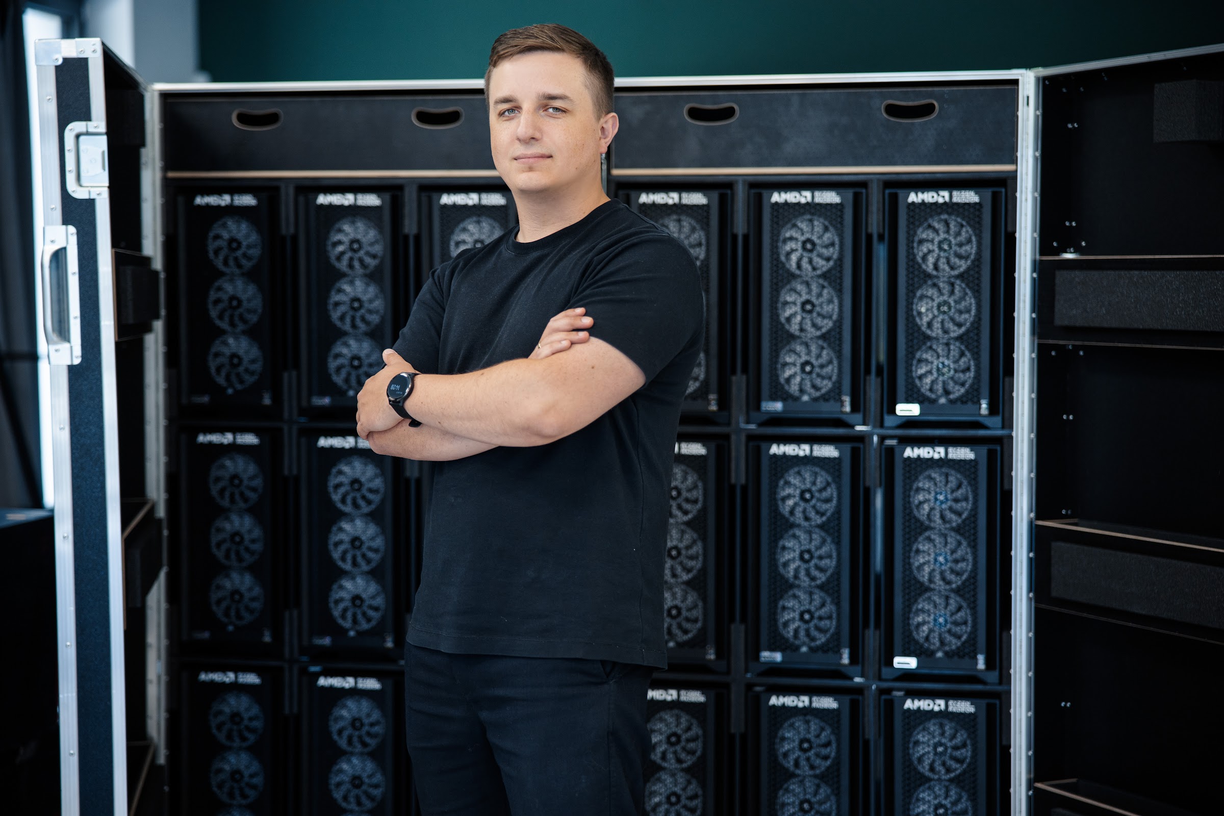 An open custom transport crate, fully loaded with prepared AMD-spec event PCs at the Warsaw hub.
